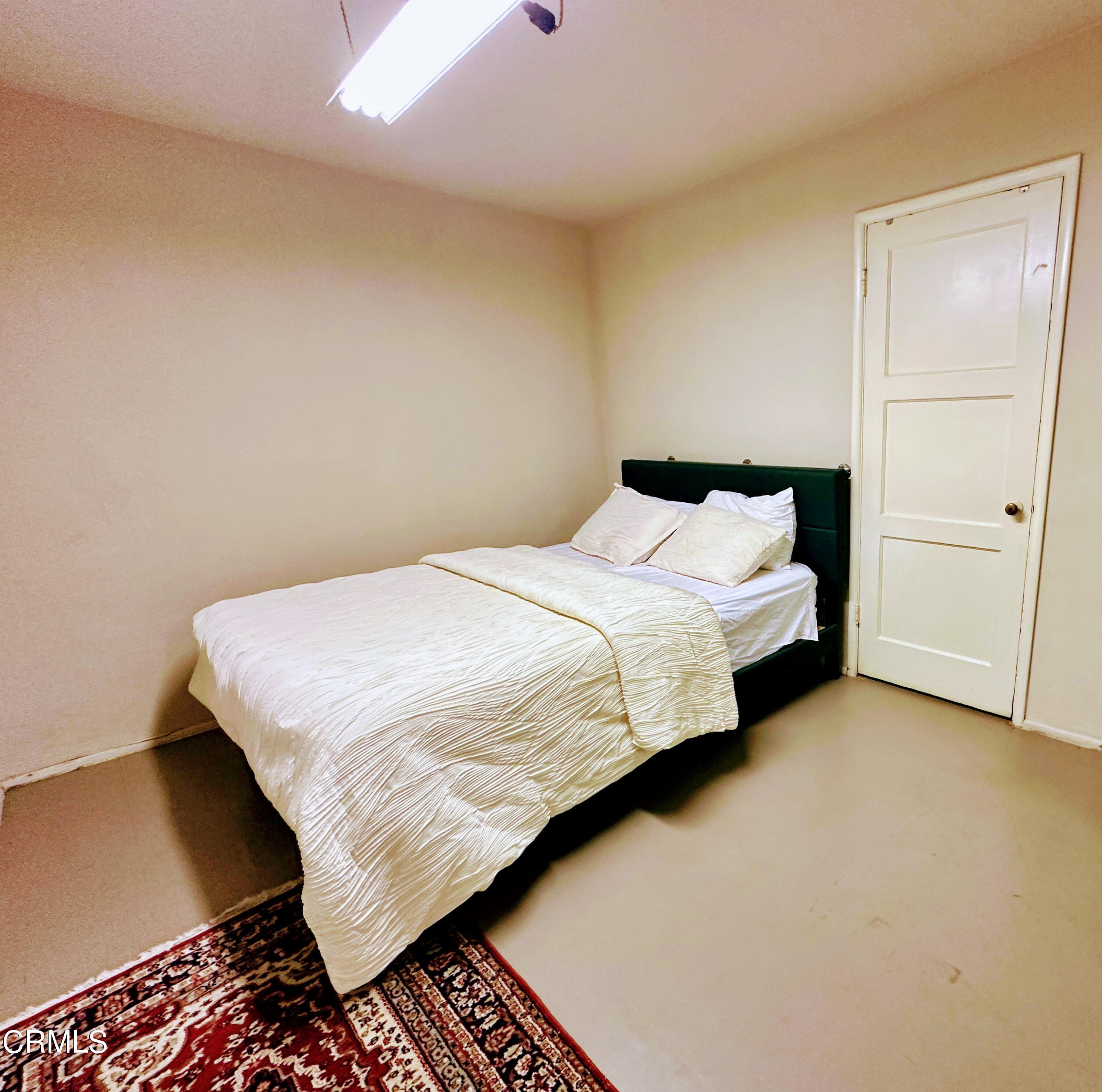 965 Jane Place Pasadena, CA 91105 - Photo 7 of 10 a bed sitting in a bedroom next to a cabinet