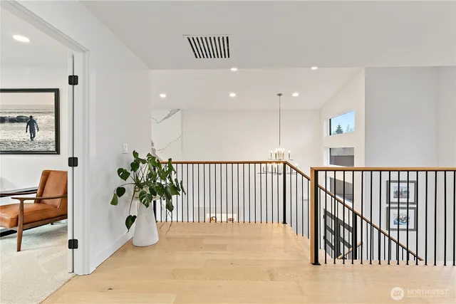 a view of a hallway with a potted plant
