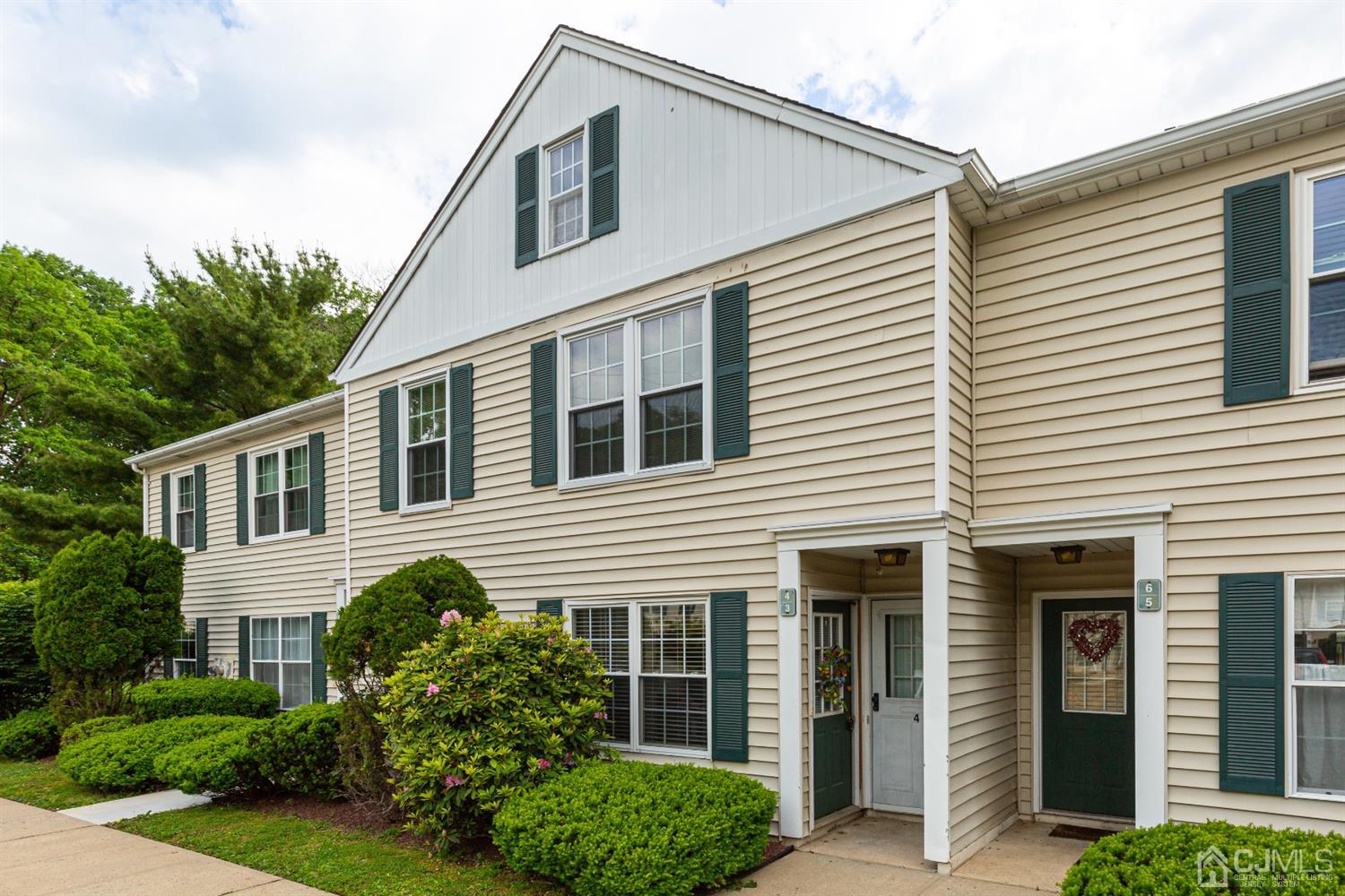 4 Hanover Square Middlesex, NJ 08846 - Photo 2 of 15 a front view of a house with plants and garden