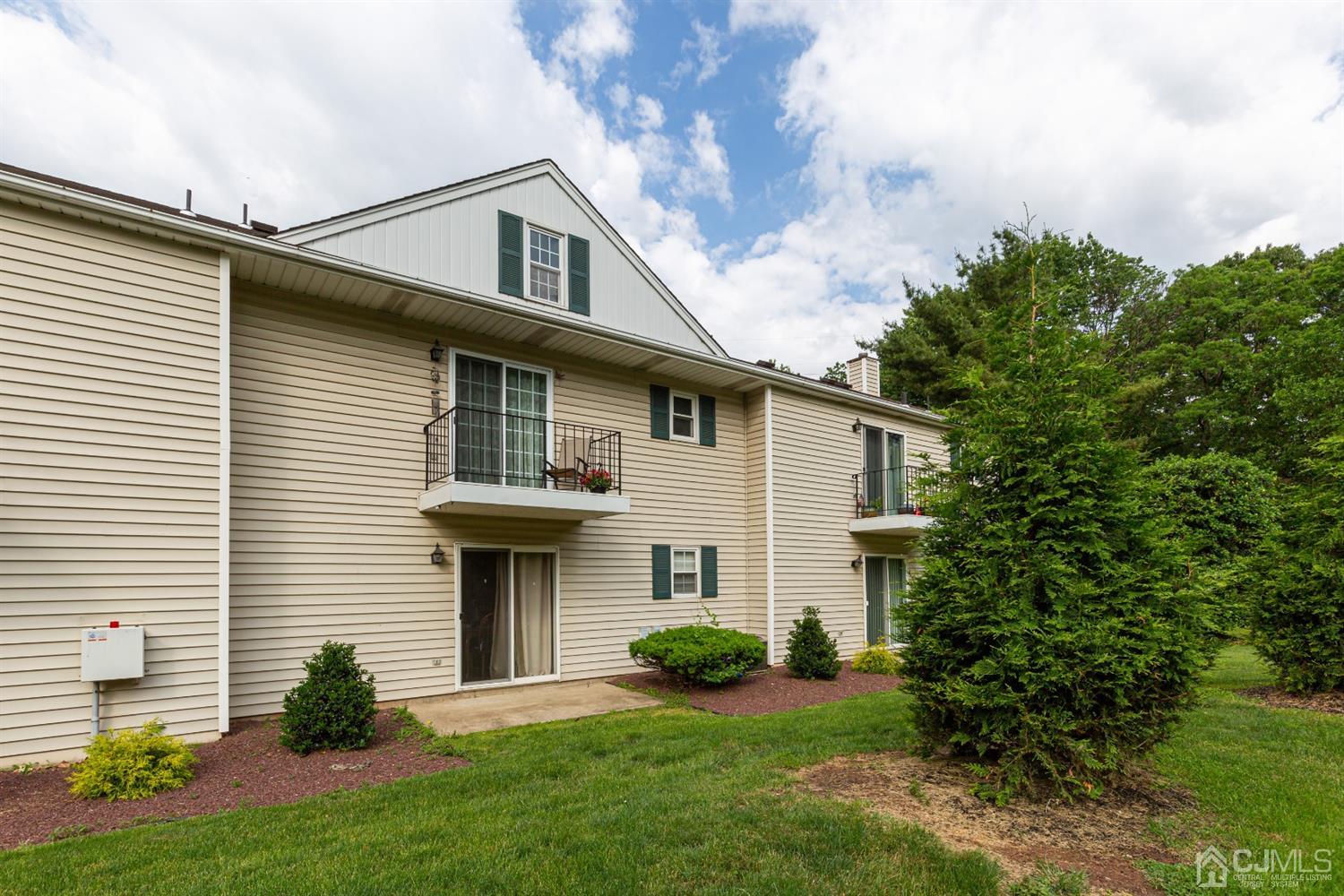 4 Hanover Square Middlesex, NJ 08846 - Photo 15 of 15 a front view of a house with garden