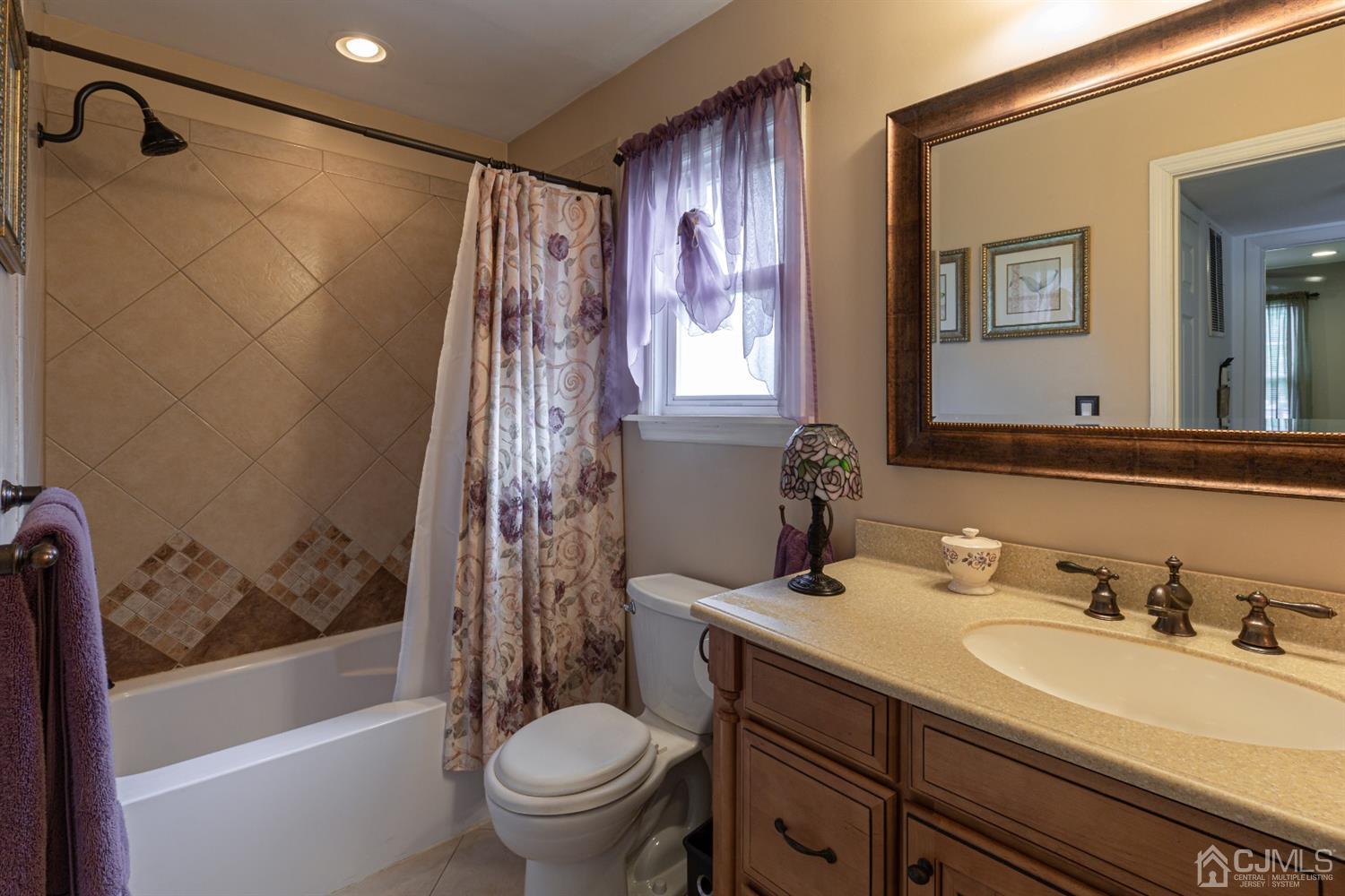 4 Hanover Square Middlesex, NJ 08846 - Photo 9 of 15 a bathroom with a sink a toilet and a bathtub