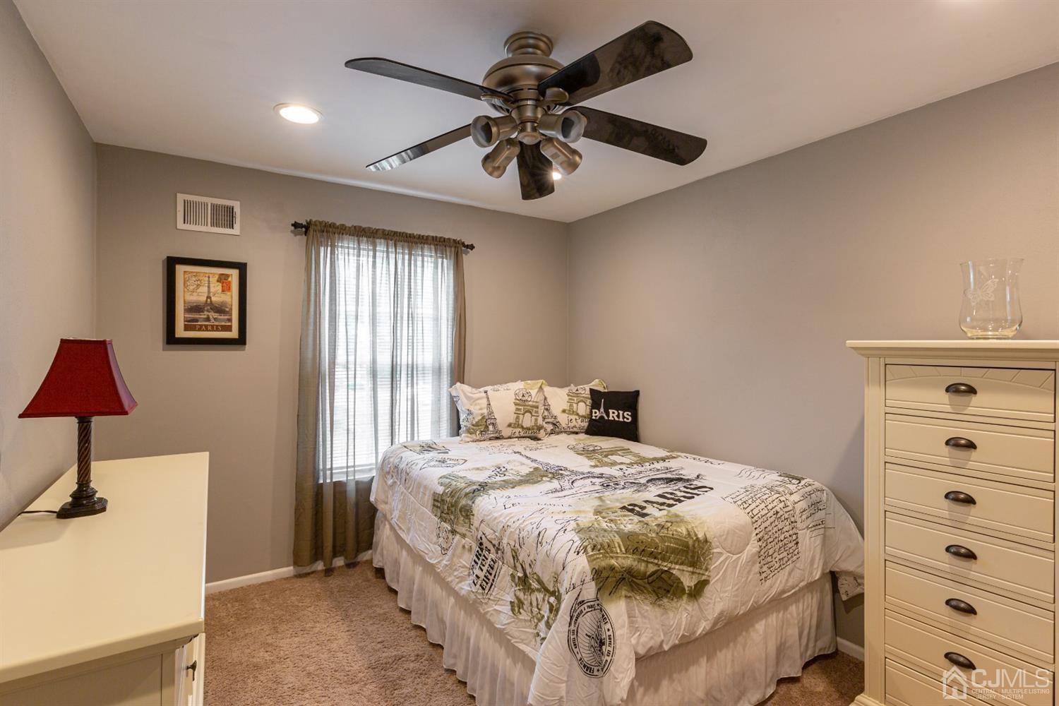 4 Hanover Square Middlesex, NJ 08846 - Photo 10 of 15 a bedroom with a bed and a chandelier