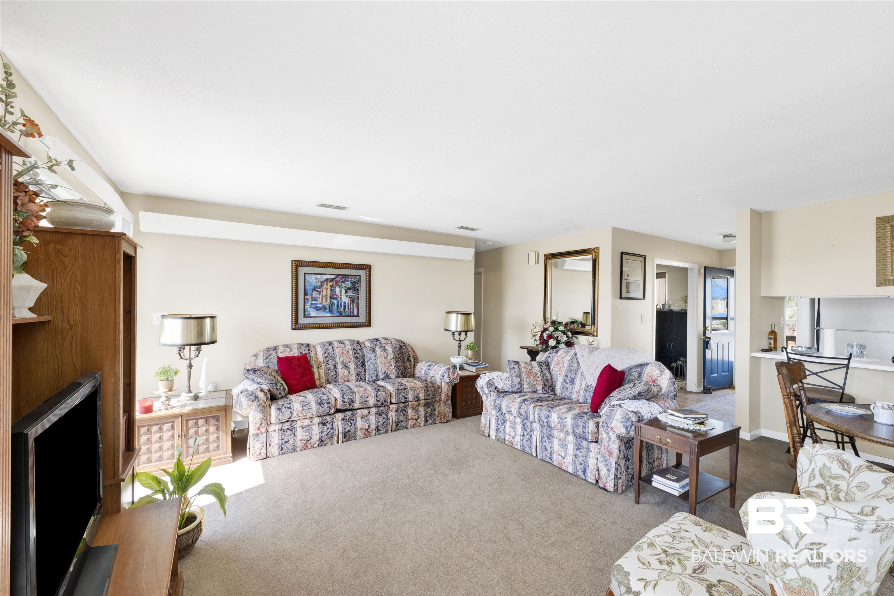 26222 Marina Road Orange Beach, AL 36561 - Photo 16 of 38 Carpeted living area featuring a fireplace