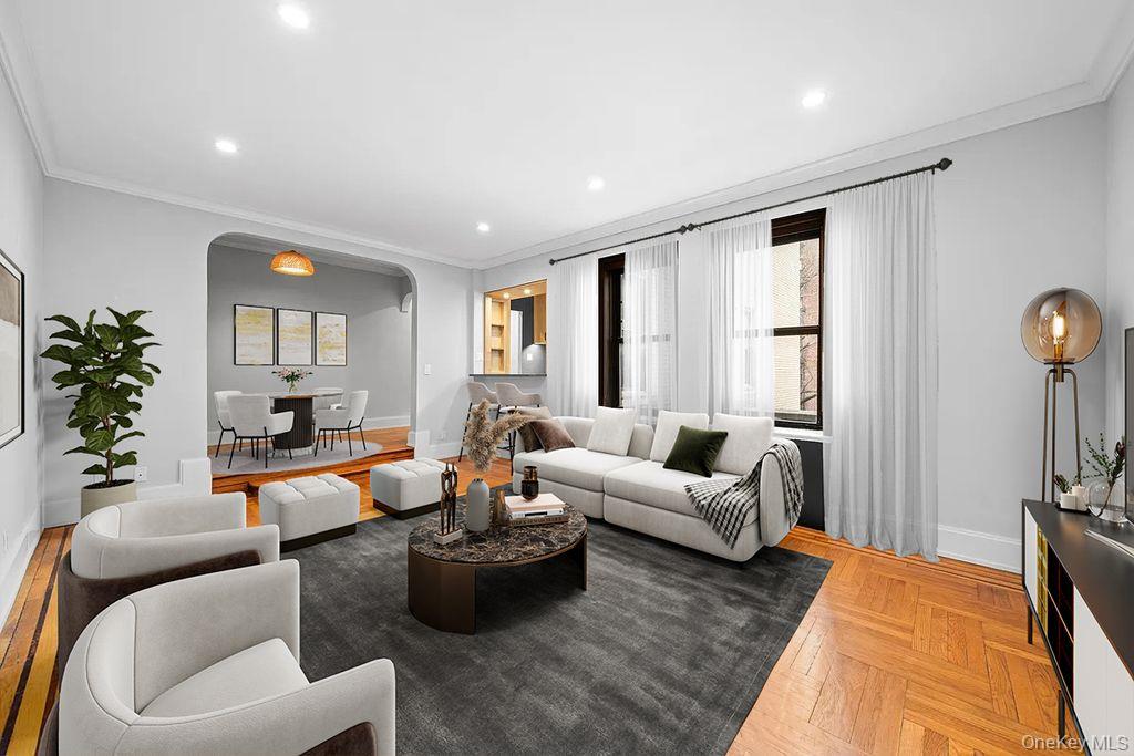 95 Park Terrace East, Unit 1D Manhattan, NY 10034 - Photo 14 of 20 Living room with arched walkways, ornamental molding, and recessed lighting