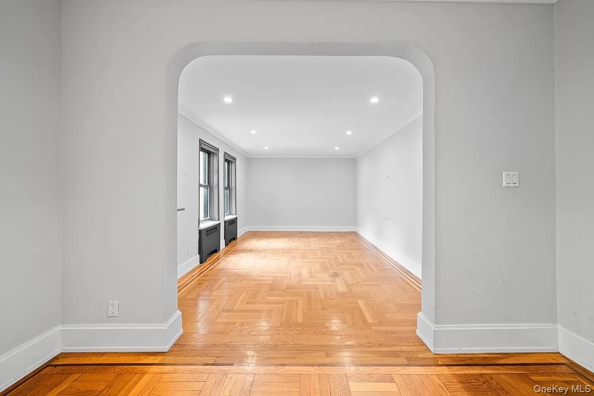 95 Park Terrace East, Unit 1D Manhattan, NY 10034 - Photo 15 of 20 Hall with recessed lighting, arched walkways, and ornamental molding