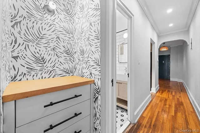 a view of bedroom with a bed and wooden floor