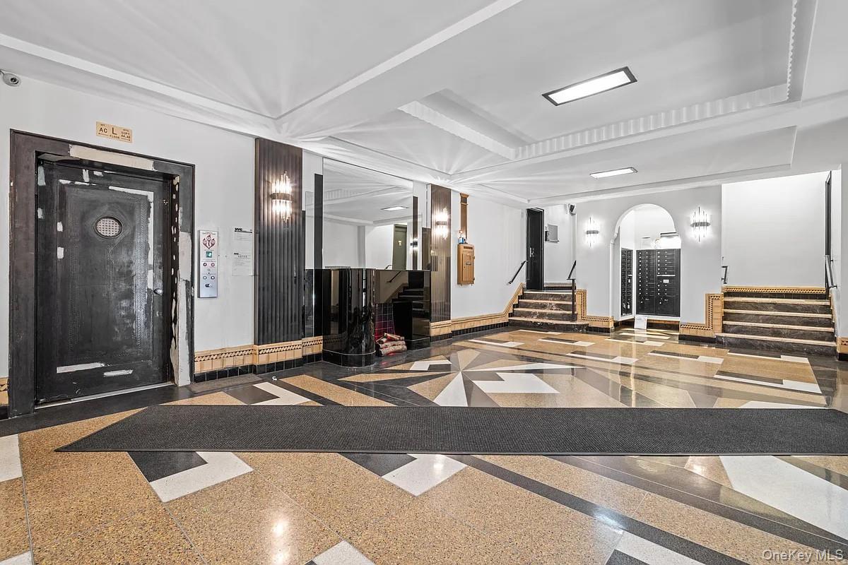 95 Park Terrace East, Unit 1D Manhattan, NY 10034 - Photo 8 of 20 Building lobby featuring stairway