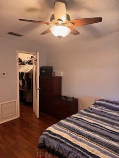 7200 Northwest 2nd Avenue, Unit 87 Boca Raton, FL 33487 - Photo 12 of 17 a bedroom with a bed and wooden floor