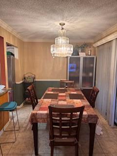 7200 Northwest 2nd Avenue, Unit 87 Boca Raton, FL 33487 - Photo 9 of 17 a room with a table chairs and refrigerator