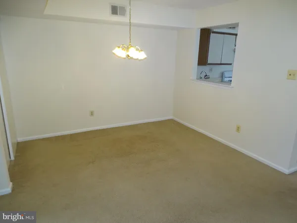 an empty room with a view of a bathroom
