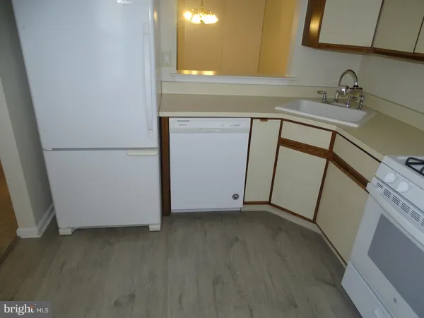 a view of a storage and utility room with a sink