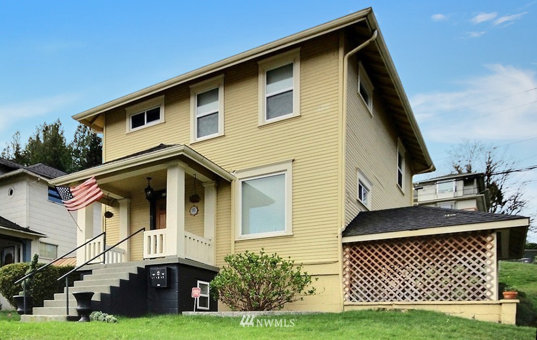 3302 Rucker Avenue Everett, WA 98201 - Photo 1 of 22 a front view of a house with a yard
