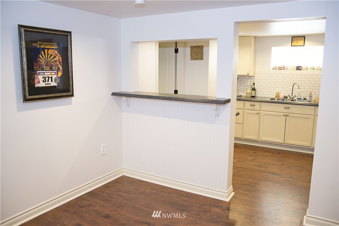 3302 Rucker Avenue Everett, WA 98201 - Photo 5 of 22 a view of a kitchen with wooden floor