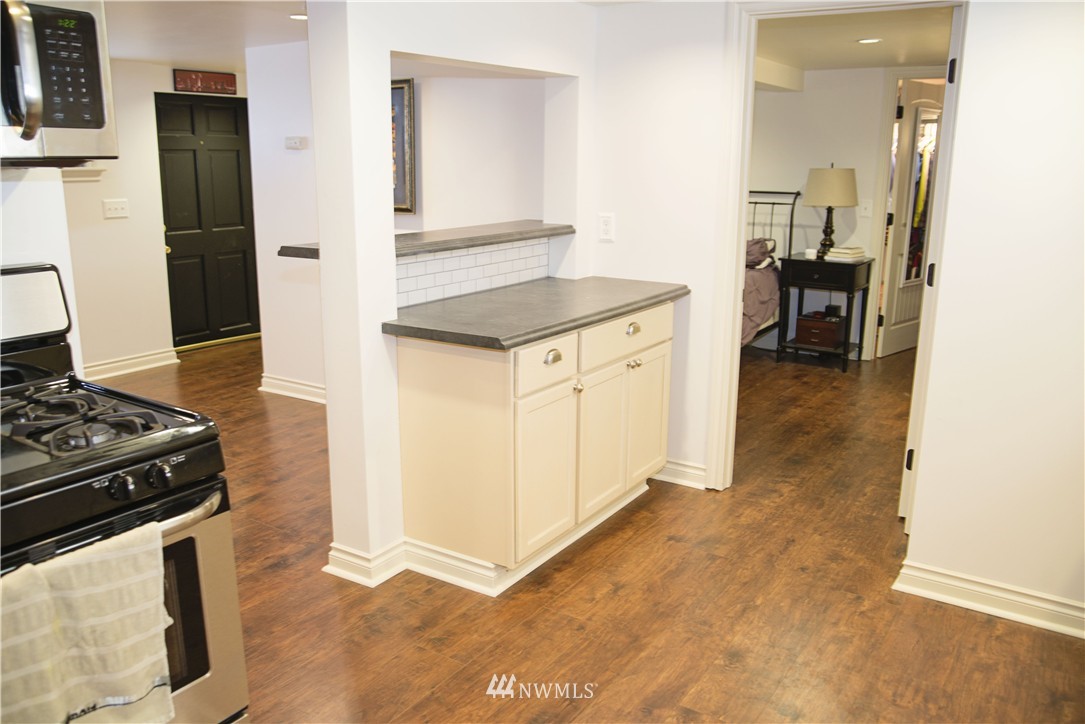 3302 Rucker Avenue Everett, WA 98201 - Photo 6 of 22 a kitchen with a stove and a refrigerator