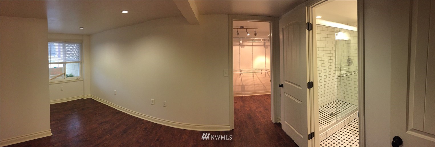 3302 Rucker Avenue Everett, WA 98201 - Photo 8 of 22 wooden floor in an empty room with a window