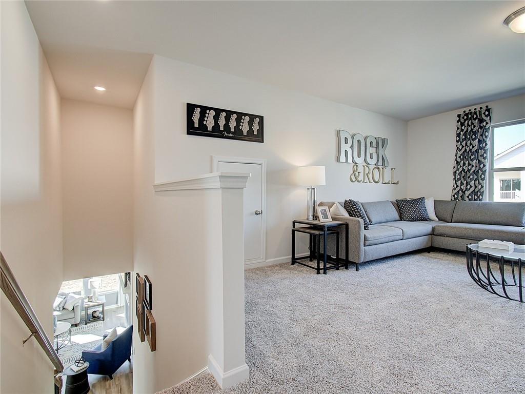 486 Tallulah Lane Grayson, GA 30017 - Photo 13 of 17 a living room with furniture and a table