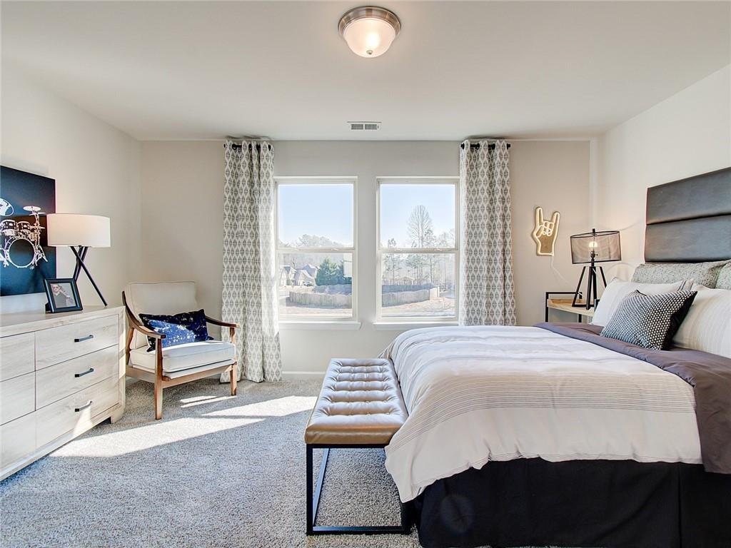 486 Tallulah Lane Grayson, GA 30017 - Photo 15 of 17 a bedroom with furniture and a window