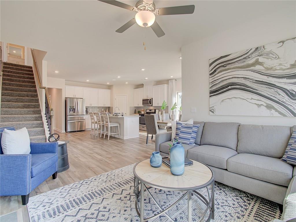 486 Tallulah Lane Grayson, GA 30017 - Photo 8 of 17 a living room with furniture kitchen view and a table