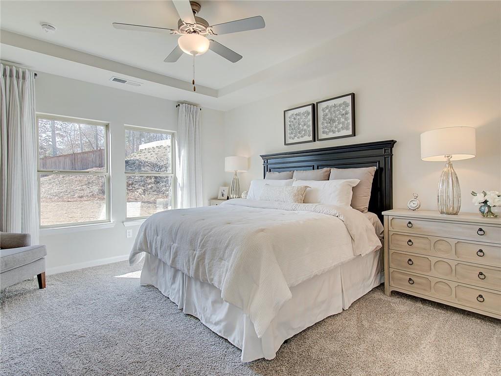 486 Tallulah Lane Grayson, GA 30017 - Photo 9 of 17 a bedroom with a bed and a window