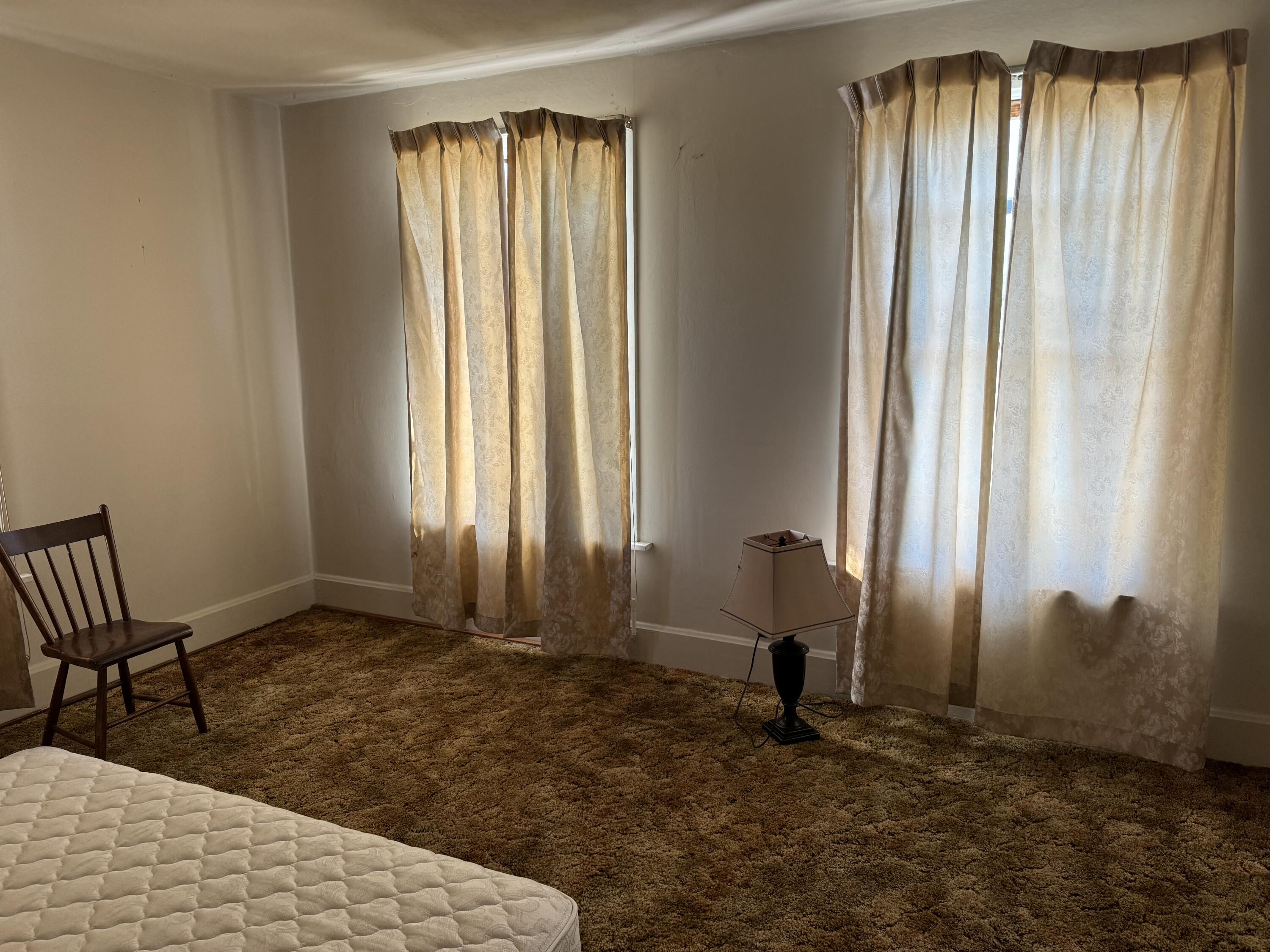 219 North Grant Street Crown Point, IN 46307 - Photo 9 of 17 a view of a room that has a window and a chair