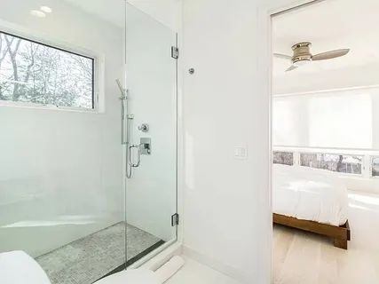 a bathroom with a tub and a shower