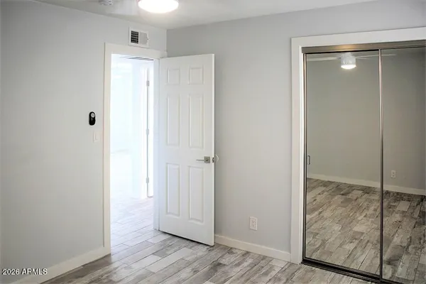 a view of entryway with wooden floor