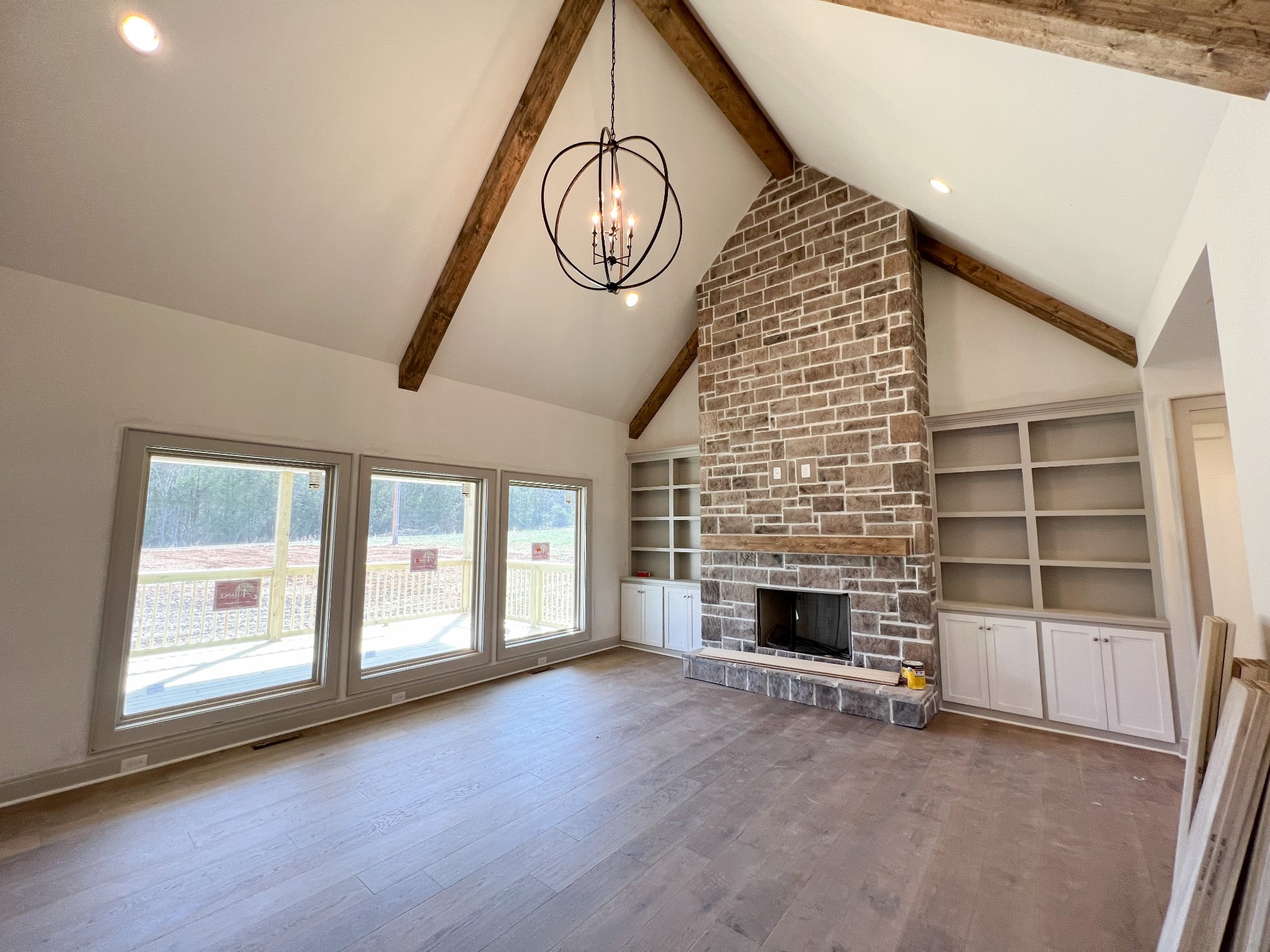 6575 Simmons Bluff Road Lebanon, TN 37090 - Photo 7 of 24 a view of an empty room with a fireplace and a window
