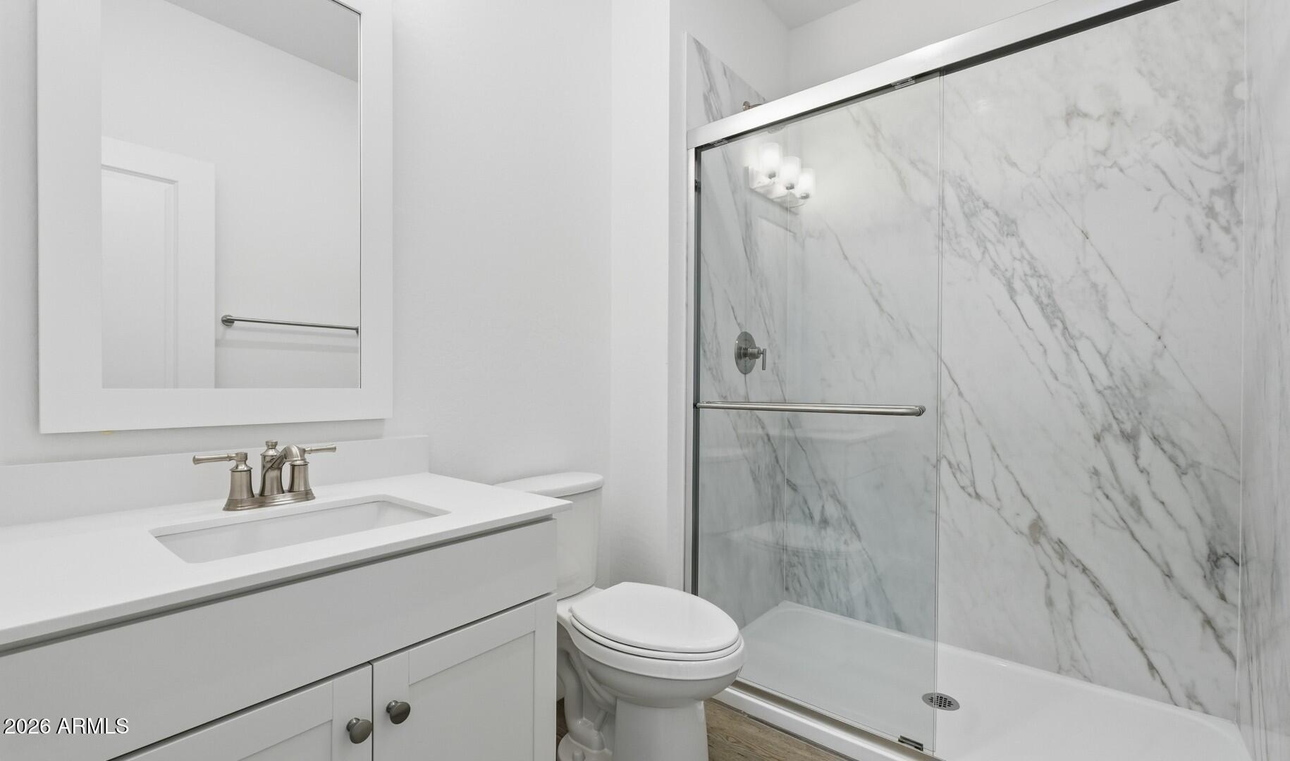 8010 West Royal Palm Road Peoria, AZ 85345 - Photo 11 of 34 a bathroom with a sink toilet and shower