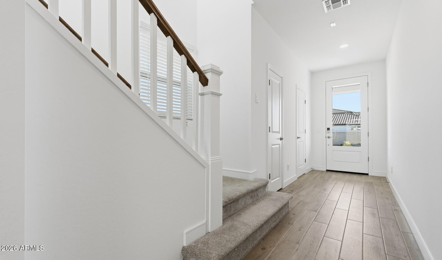 8010 West Royal Palm Road Peoria, AZ 85345 - Photo 12 of 34 a view of a hallway with wooden floor and entryway