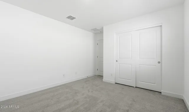 an empty room with closet