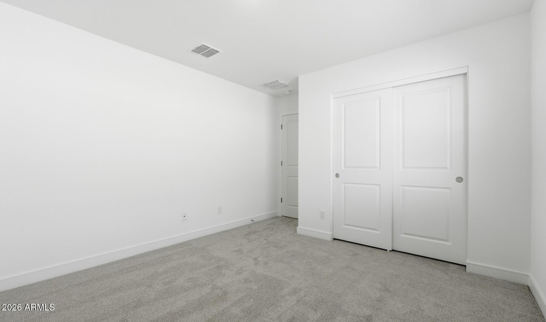 8010 West Royal Palm Road Peoria, AZ 85345 - Photo 15 of 34 an empty room with closet
