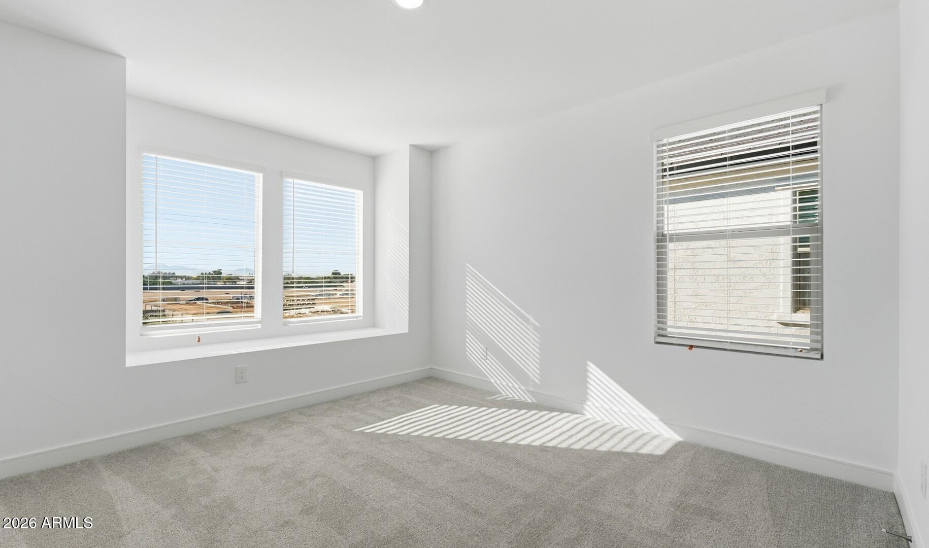 8010 West Royal Palm Road Peoria, AZ 85345 - Photo 18 of 34 a view of an empty room with a window