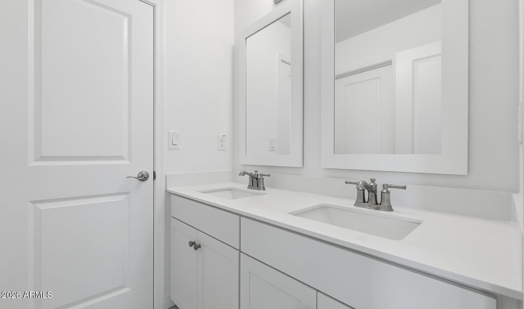 8010 West Royal Palm Road Peoria, AZ 85345 - Photo 19 of 34 a bathroom with a sink and a mirror