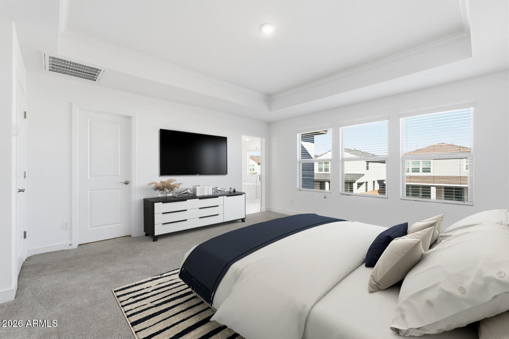 8010 West Royal Palm Road Peoria, AZ 85345 - Photo 25 of 34 a bedroom with a bed and a flat screen tv