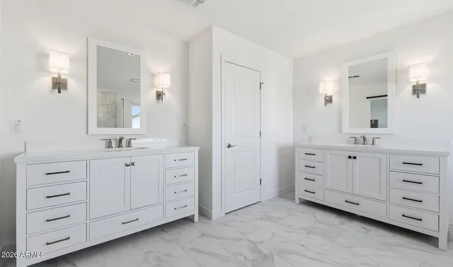 a bathroom with a bathtub a shower a sink and mirror