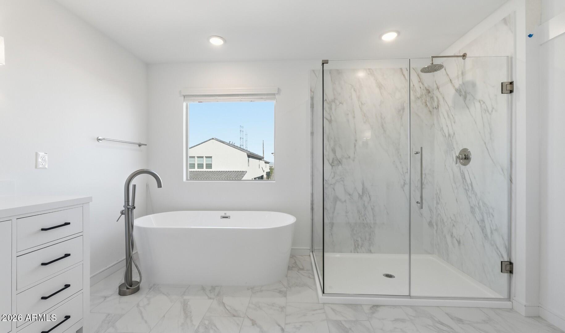 8010 West Royal Palm Road Peoria, AZ 85345 - Photo 28 of 34 a bathroom with a bathtub a shower a sink and mirror