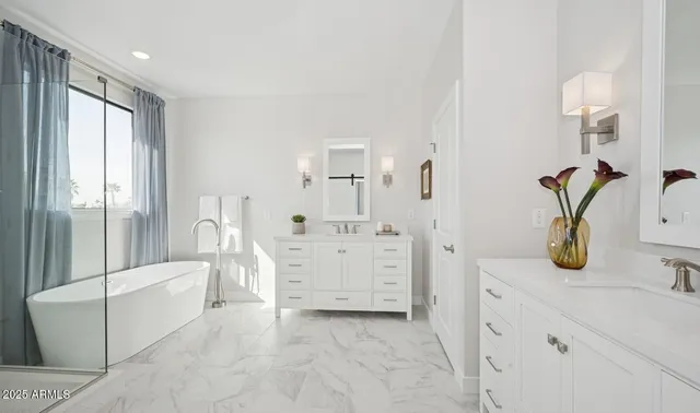 a spacious bedroom with a bed and a window