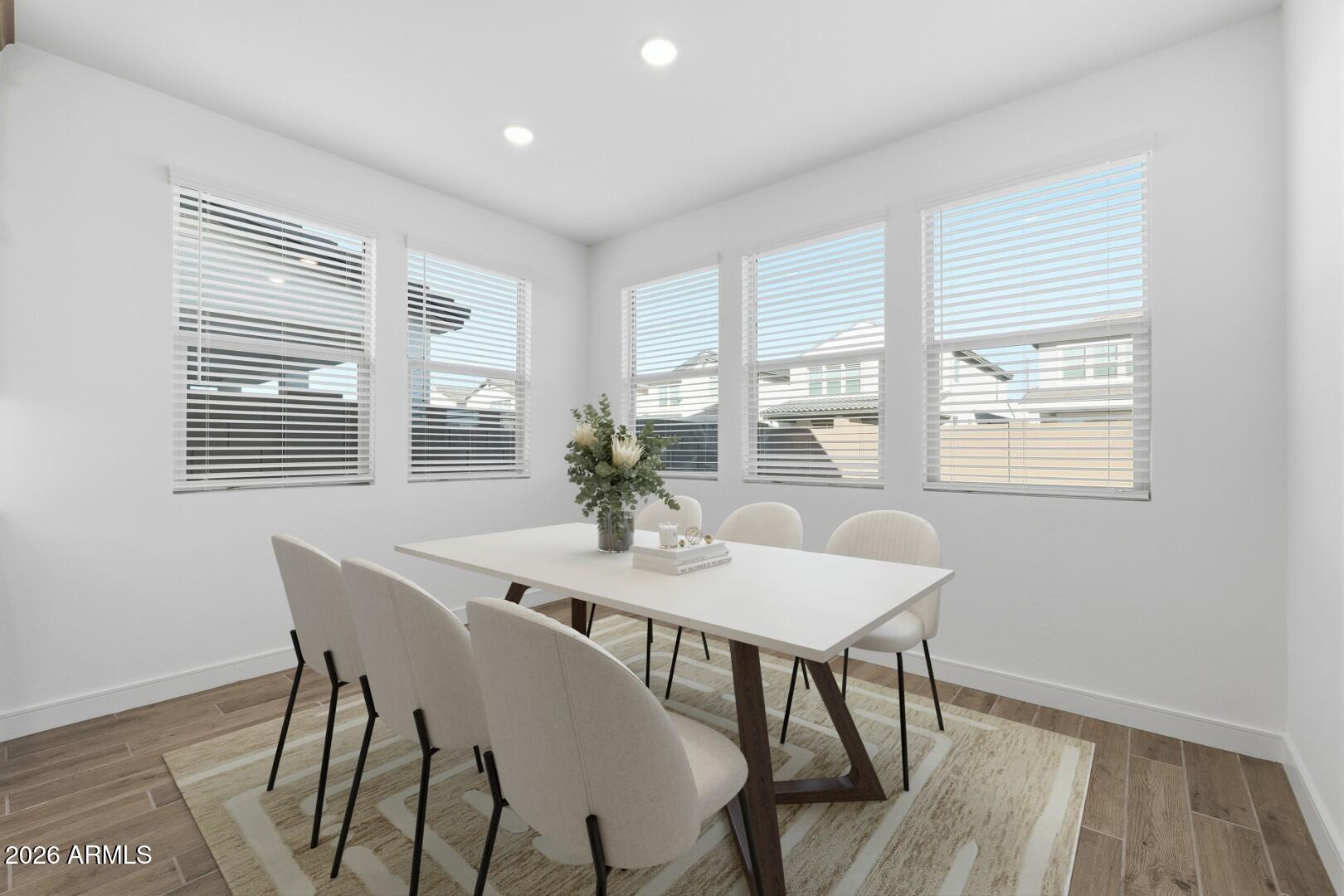8010 West Royal Palm Road Peoria, AZ 85345 - Photo 6 of 34 a view of a dining room with furniture windows and wooden floor