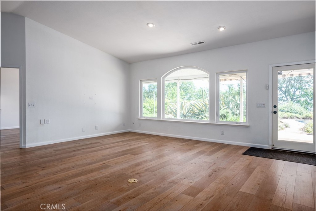 4620 Wendlis Road Forest Ranch, CA 95942 - Photo 13 of 50 an empty room with wooden floor and windows