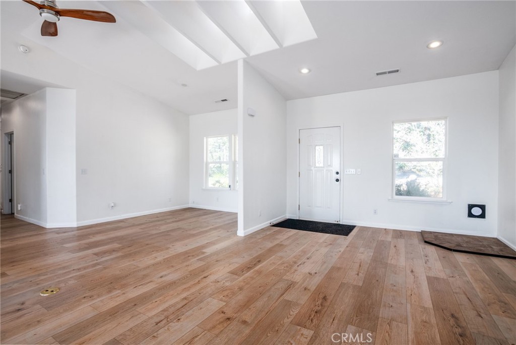 4620 Wendlis Road Forest Ranch, CA 95942 - Photo 15 of 50 an empty room with wooden floor cabinet and windows