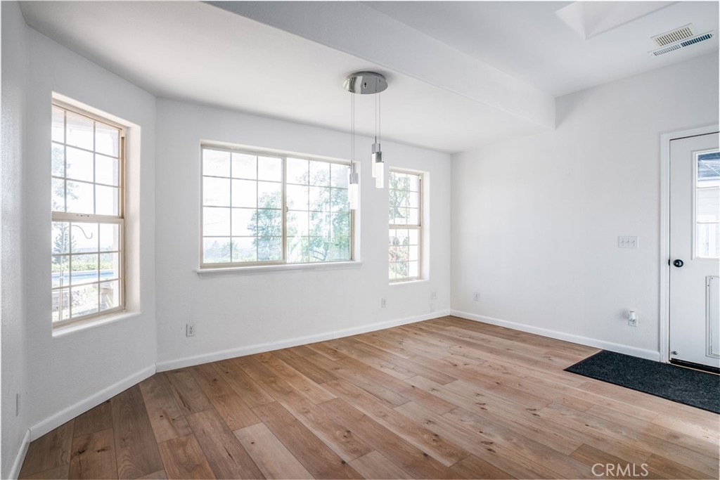 4620 Wendlis Road Forest Ranch, CA 95942 - Photo 24 of 50 an empty room with wooden floor and windows