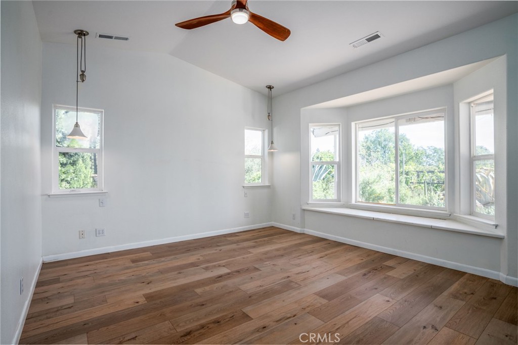 4620 Wendlis Road Forest Ranch, CA 95942 - Photo 27 of 50 a view of an empty room with wooden floor and a window