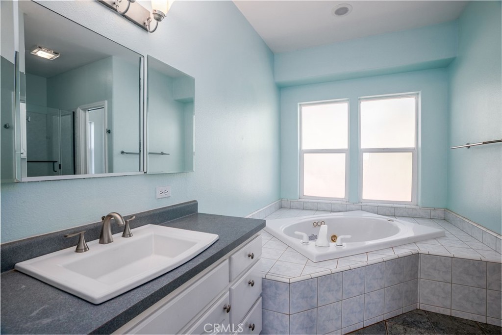 4620 Wendlis Road Forest Ranch, CA 95942 - Photo 29 of 50 a bathroom with a tub sink and mirror
