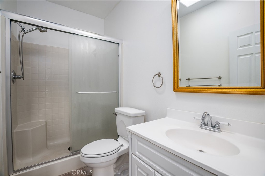 4620 Wendlis Road Forest Ranch, CA 95942 - Photo 32 of 50 a bathroom with a sink toilet and mirror