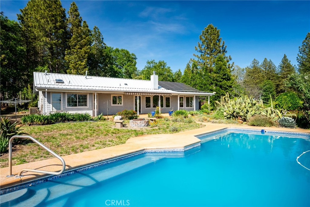4620 Wendlis Road Forest Ranch, CA 95942 - Photo 35 of 50 a view of house with swimming pool outdoor seating