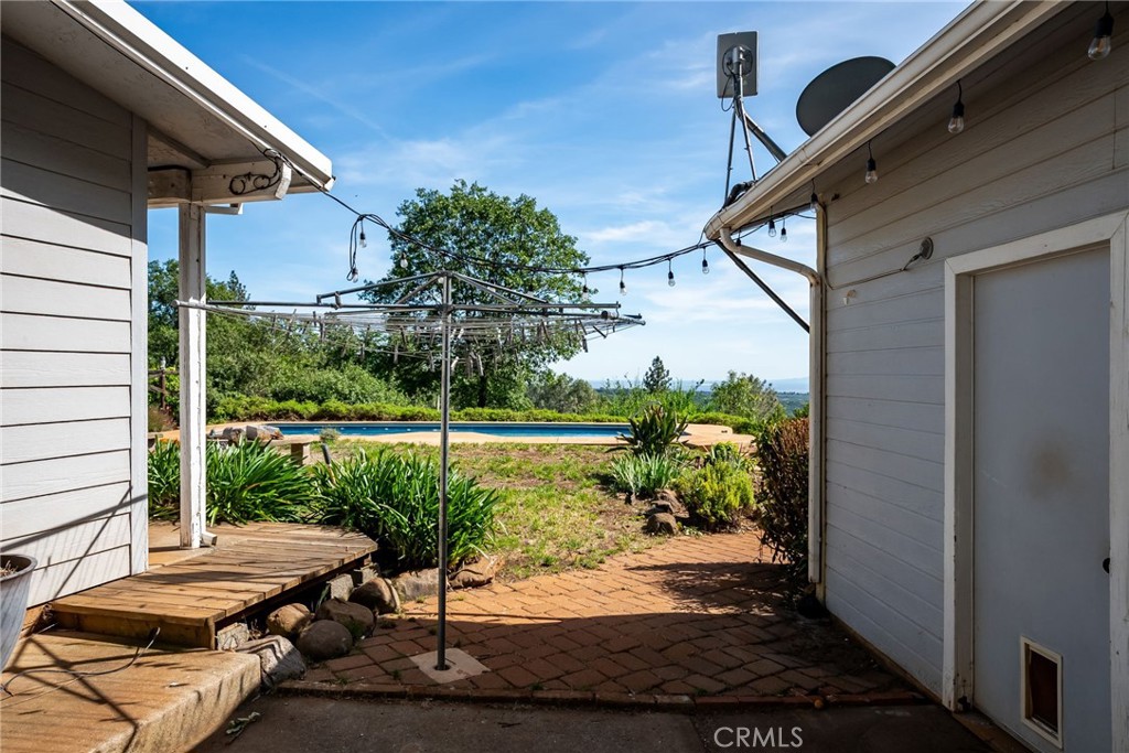 4620 Wendlis Road Forest Ranch, CA 95942 - Photo 38 of 50 a view of a balcony with lake view and a potted plant