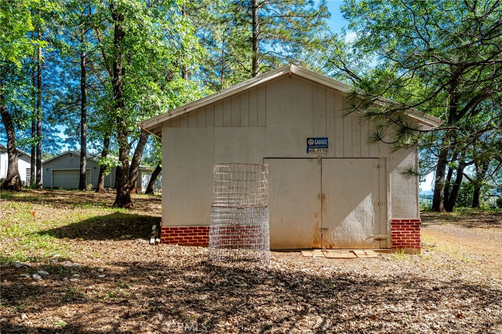4620 Wendlis Road Forest Ranch, CA 95942 - Photo 49 of 50 a house with trees in the background