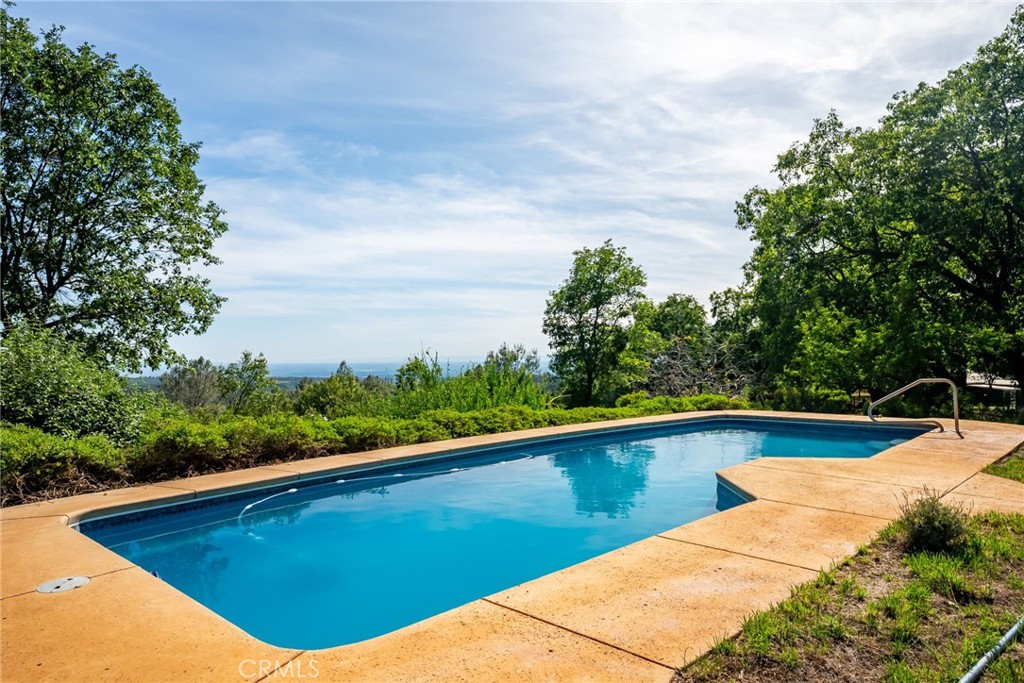 4620 Wendlis Road Forest Ranch, CA 95942 - Photo 5 of 50 a view of a swimming pool with a yard