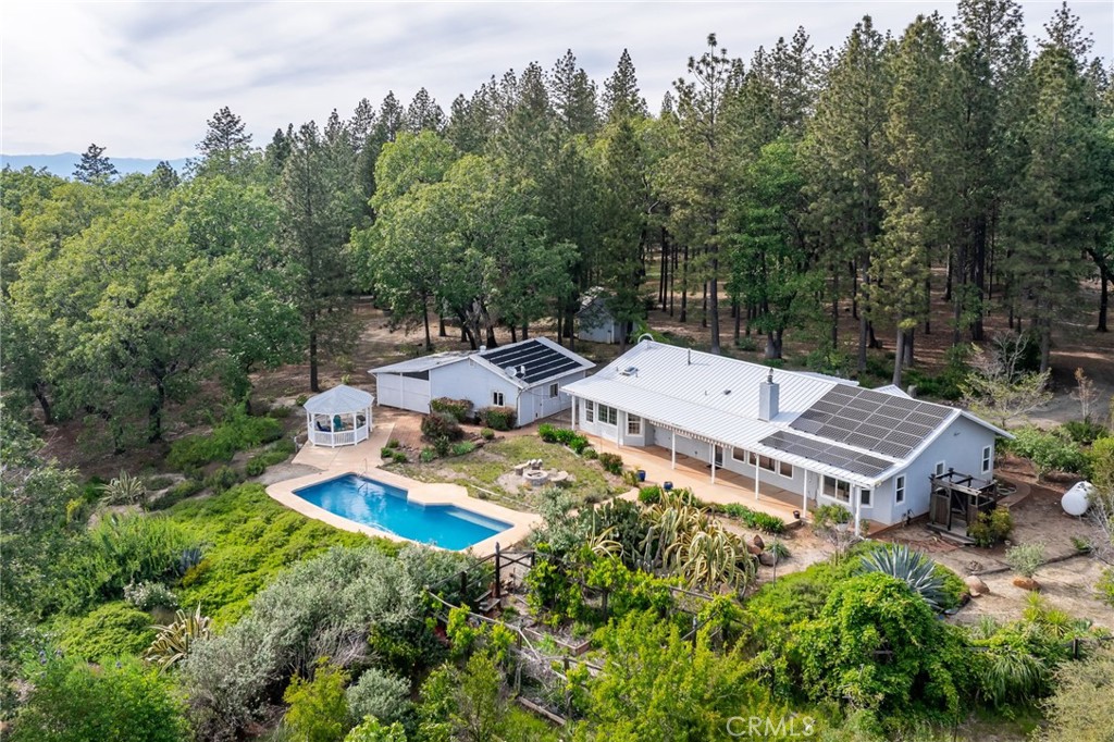 4620 Wendlis Road Forest Ranch, CA 95942 - Photo 9 of 50 an aerial view of a house with garden space and trees