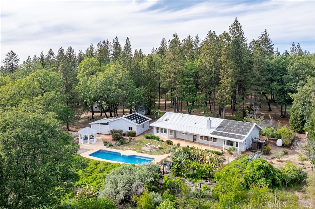4620 Wendlis Road Forest Ranch, CA 95942 - Photo 10 of 50 aerial view of a house with yard and trees in the background